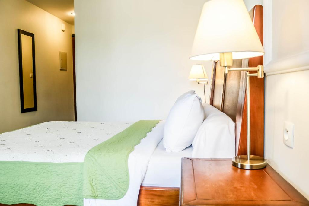 Postel nebo postele na pokoji v ubytování Tchero Hotel