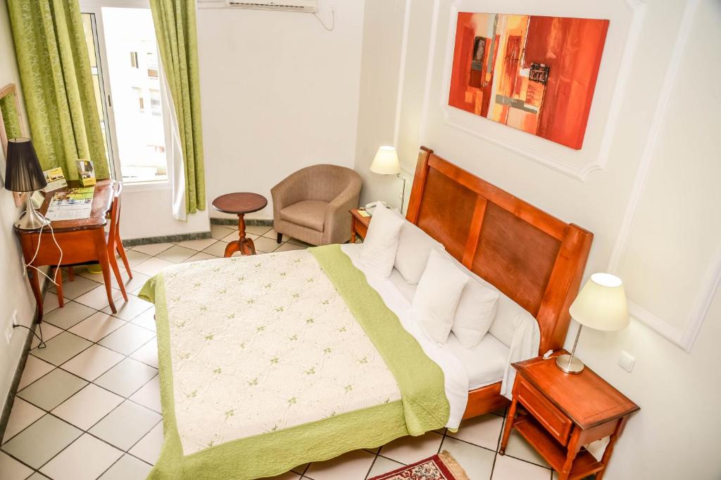Postel nebo postele na pokoji v ubytování Tchero Hotel