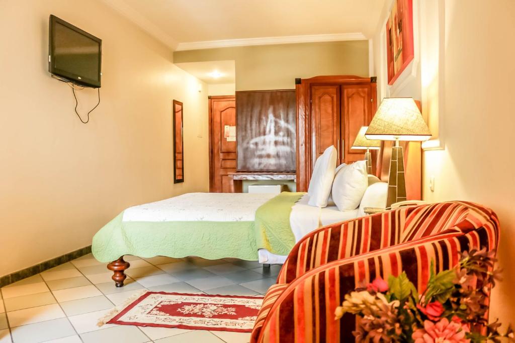 Postel nebo postele na pokoji v ubytování Tchero Hotel