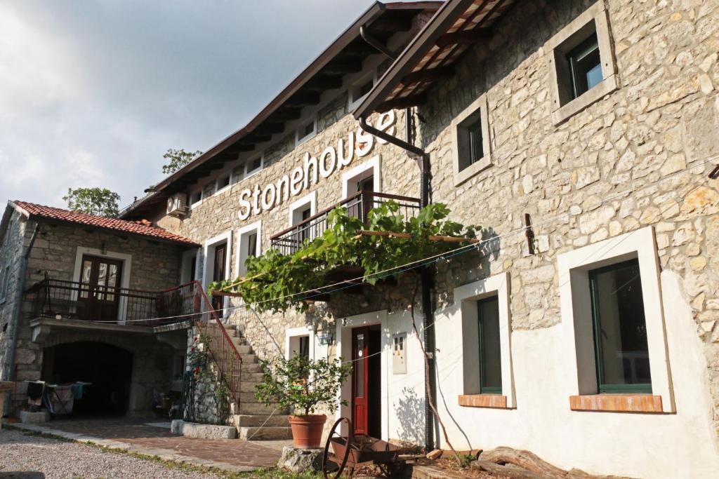 a building with a sign on the side of it at Stonehouse in Nova Gorica