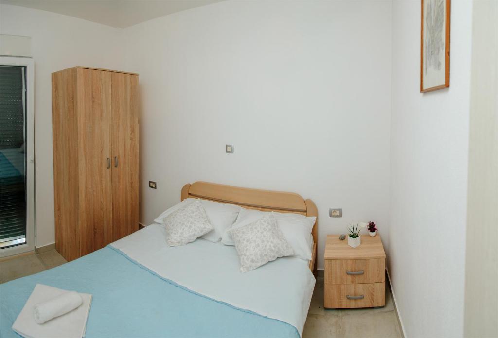 Postel nebo postele na pokoji v ubytování Apartmani Mozaici