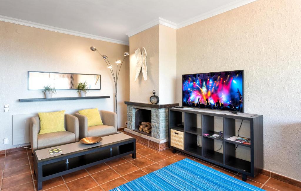 Televízia a/alebo spoločenská miestnosť v ubytovaní Costa Maresme Apartment