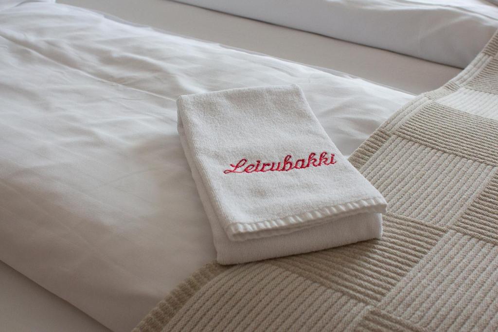 Postel nebo postele na pokoji v ubytování Hotel Leirubakki