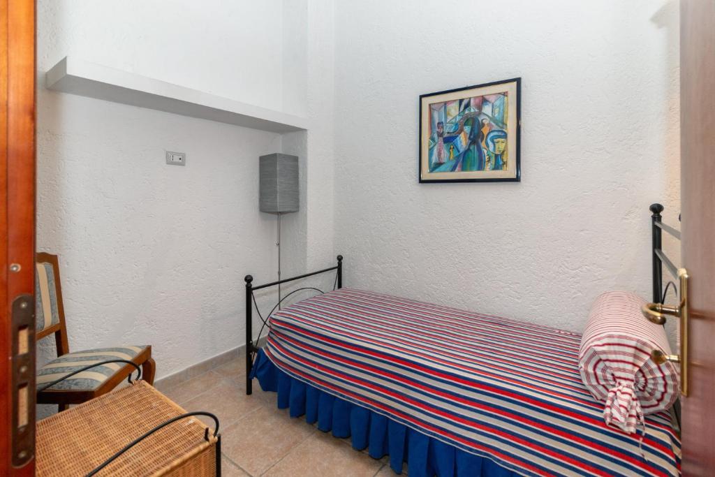 A bed or beds in a room at Casale Gli Ulivi