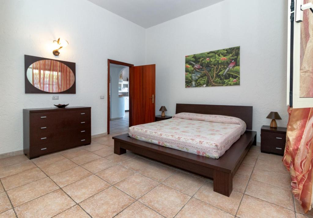 A bed or beds in a room at Casale Gli Ulivi