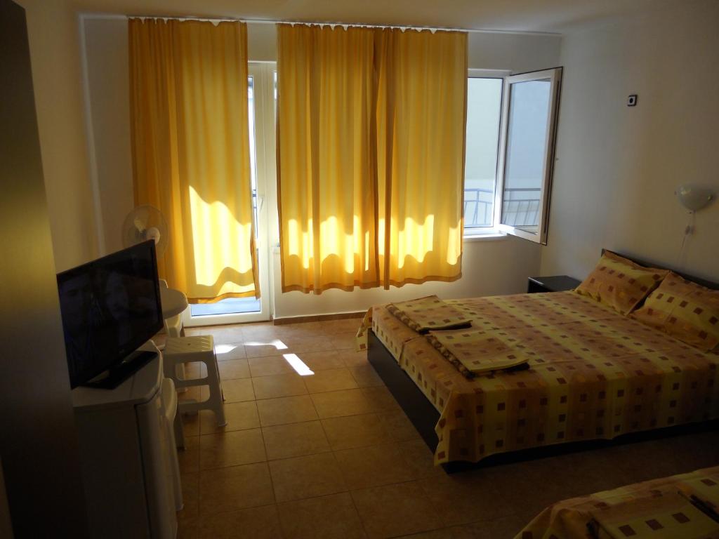 Postel nebo postele na pokoji v ubytování Guest House "Tania"