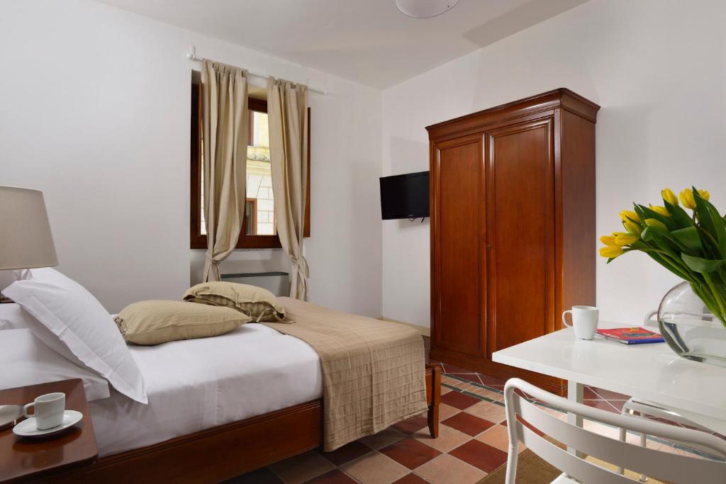 Letto o letti in una camera di Roma Resort Termini