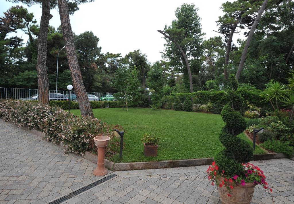 a park with plants and flowers in a park at Hotel Riviera Blu in Tirrenia