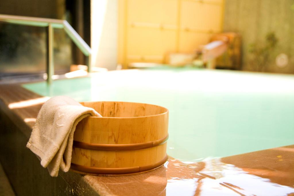 a wooden bowl sitting on top of a counter at Hotel Hanaan in Nikko