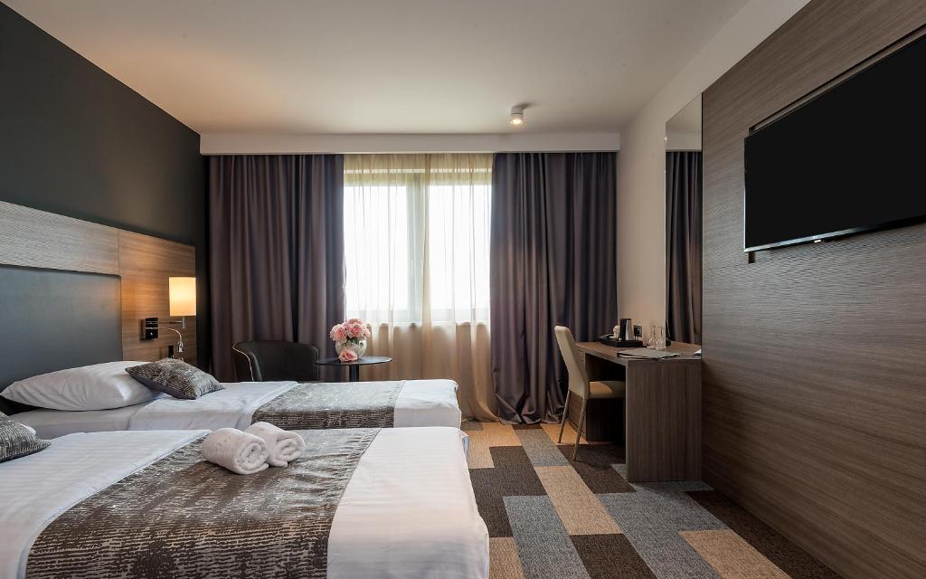 Postel nebo postele na pokoji v ubytování Hotel Princess