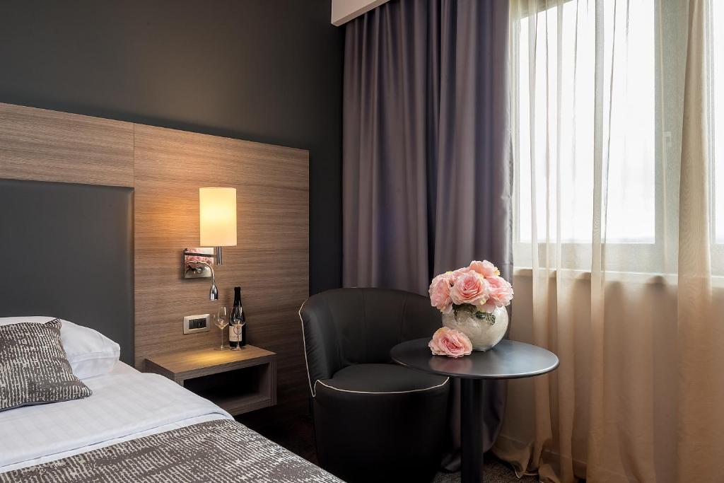 Postel nebo postele na pokoji v ubytování Hotel Princess