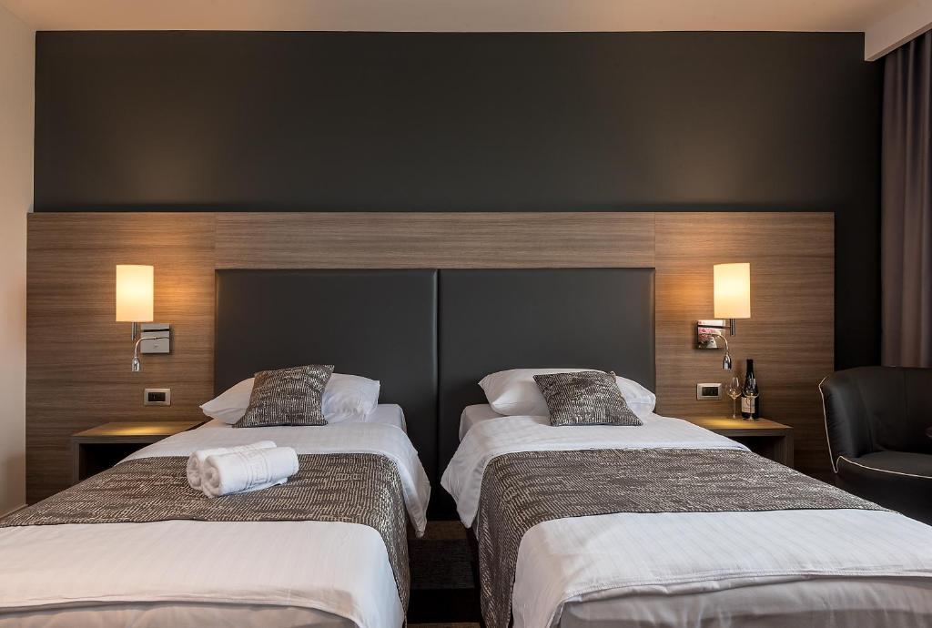 Postel nebo postele na pokoji v ubytování Hotel Princess
