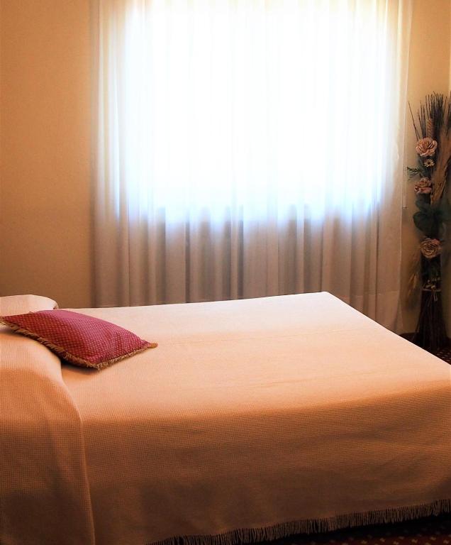 Postel nebo postele na pokoji v ubytování Hotel Belvedere