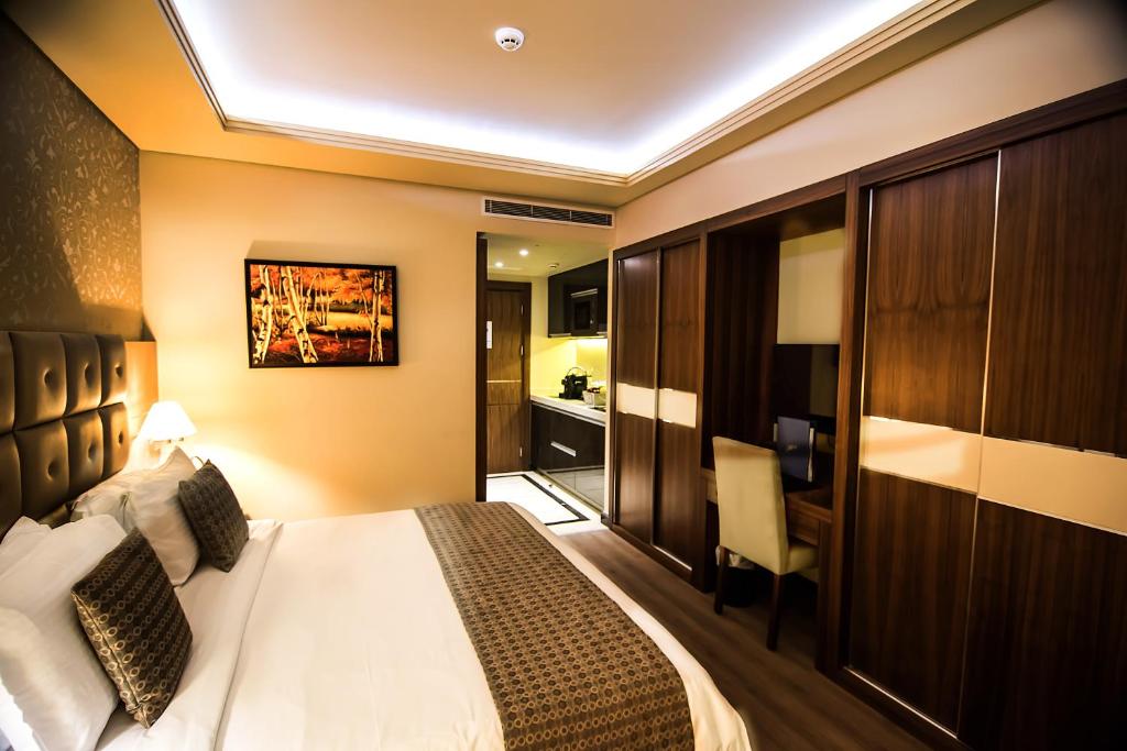 Postel nebo postele na pokoji v ubytování Gems Hotel