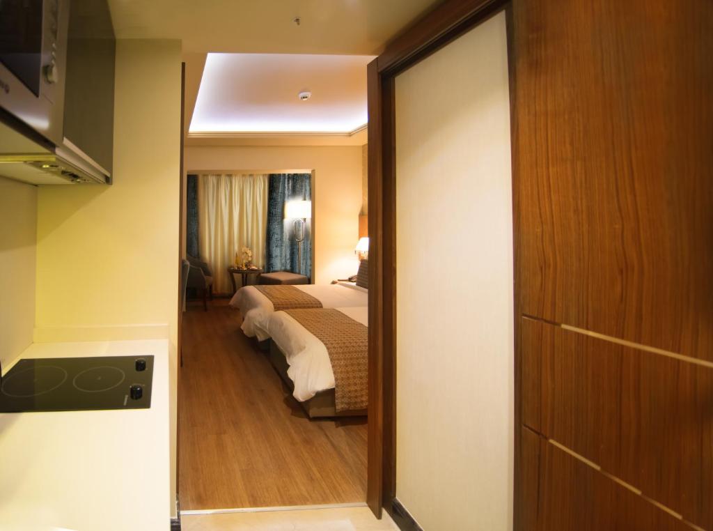 Postel nebo postele na pokoji v ubytování Gems Hotel