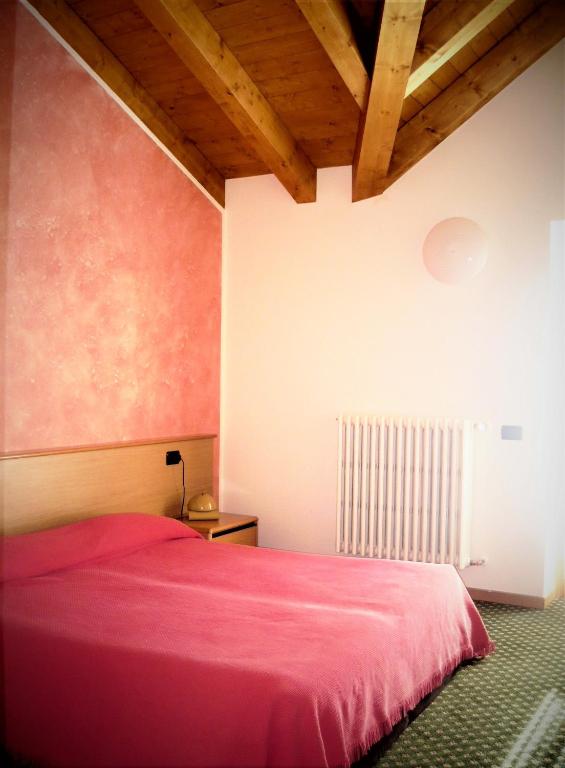 Postel nebo postele na pokoji v ubytování Hotel Belvedere