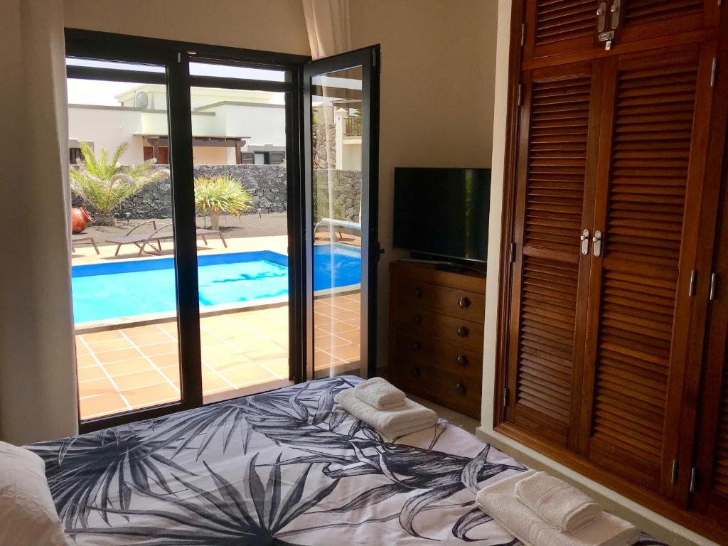 A bed or beds in a room at Villa Mici