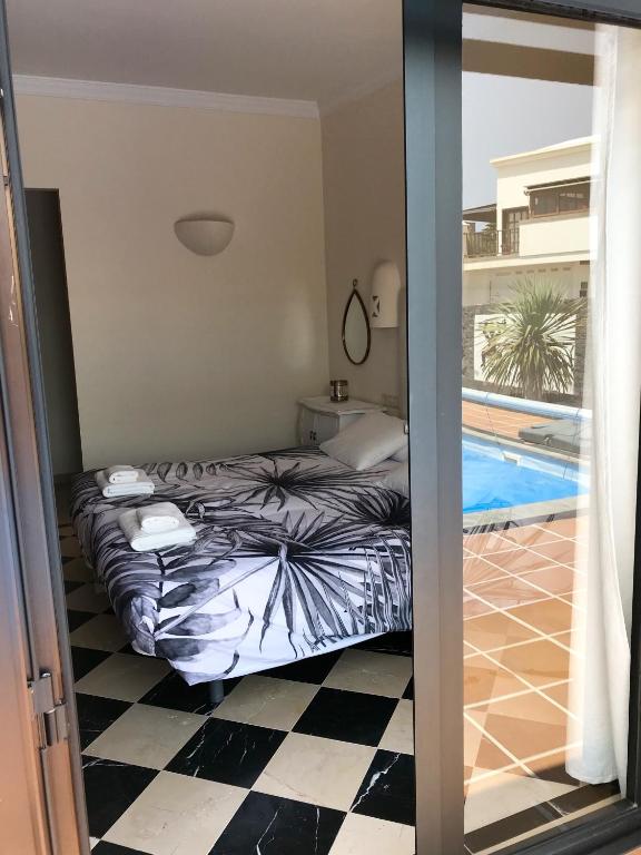 A bed or beds in a room at Villa Mici