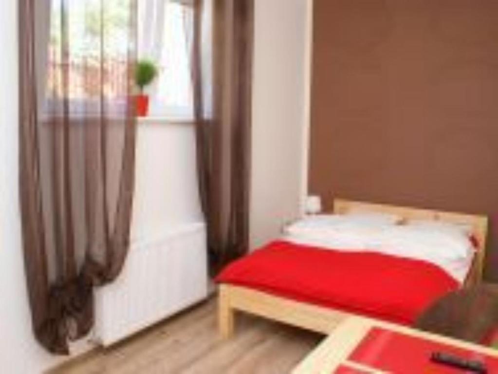 Posteľ alebo postele v izbe v ubytovaní Mini Apartamenty Dominika