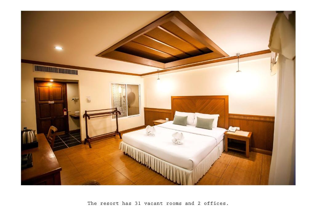 Кровать или кровати в номере Mac Resort Hotel