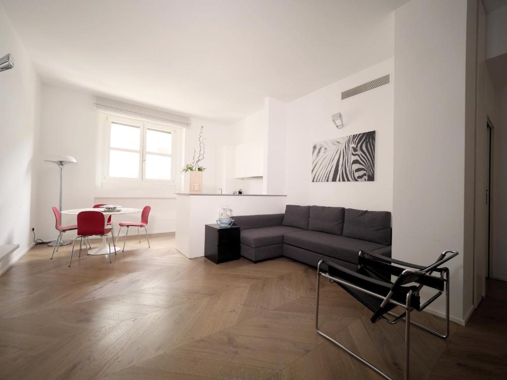 a living room with a couch and a table at Turati 3 in Milan