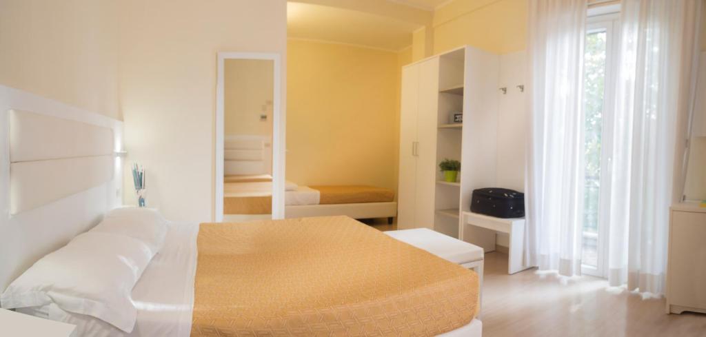 Postel nebo postele na pokoji v ubytování Hotel San Domingo