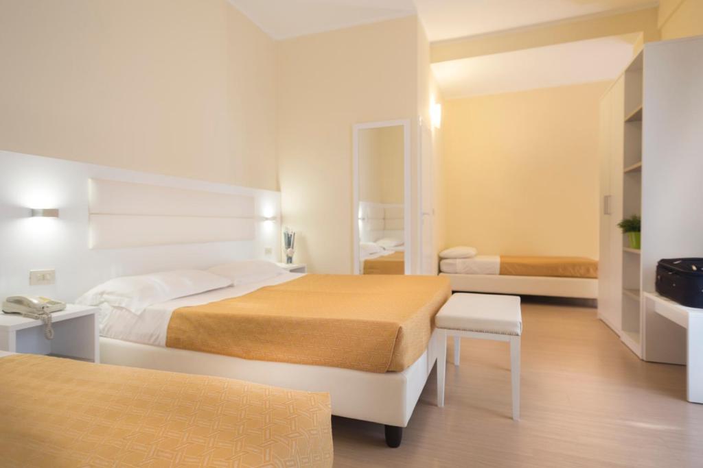 Postel nebo postele na pokoji v ubytování Hotel San Domingo