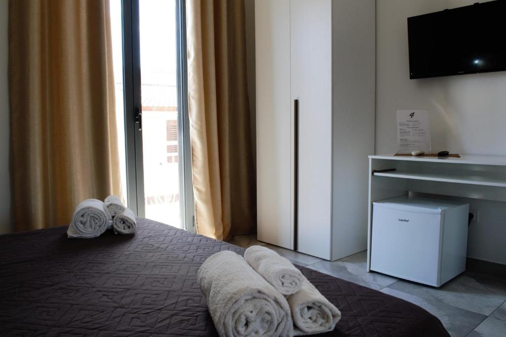 Łóżko lub łóżka w pokoju w obiekcie Four Winds B&B