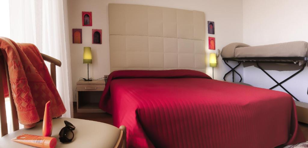 Postel nebo postele na pokoji v ubytování Hotel Telenia