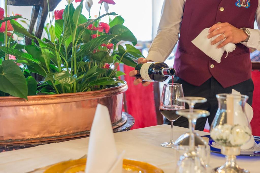 Nápoje v ubytování Hotel Alla Posta - Famiglia Pra dal 1866 a Caprile