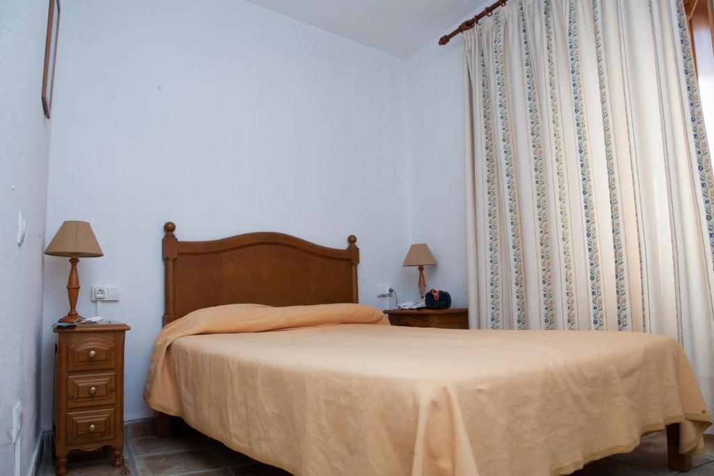 Postel nebo postele na pokoji v ubytování Hostal El Rincón
