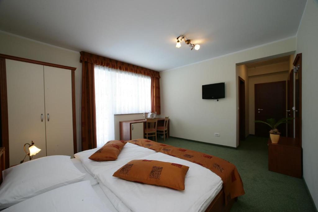 Postel nebo postele na pokoji v ubytování Hotel Aqua Roma