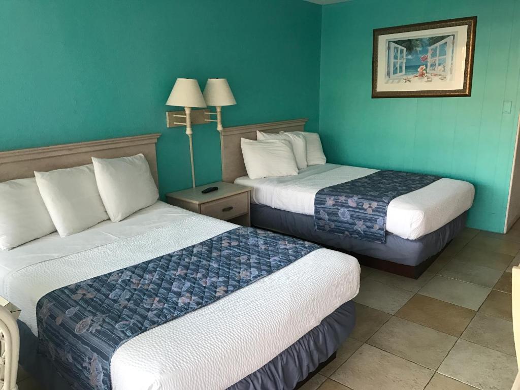 Postel nebo postele na pokoji v ubytování Tangiers Resort Motel
