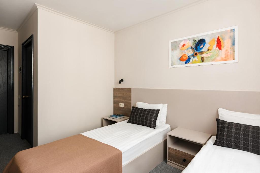 Postel nebo postele na pokoji v ubytování Deribas Hotel