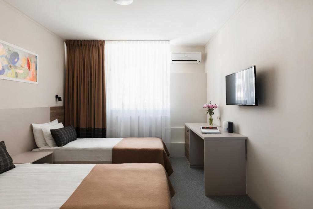 Postel nebo postele na pokoji v ubytování Deribas Hotel