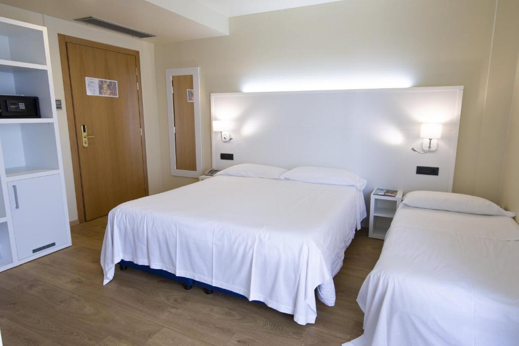 Postel nebo postele na pokoji v ubytování Hotel Parigi 2 & Spa