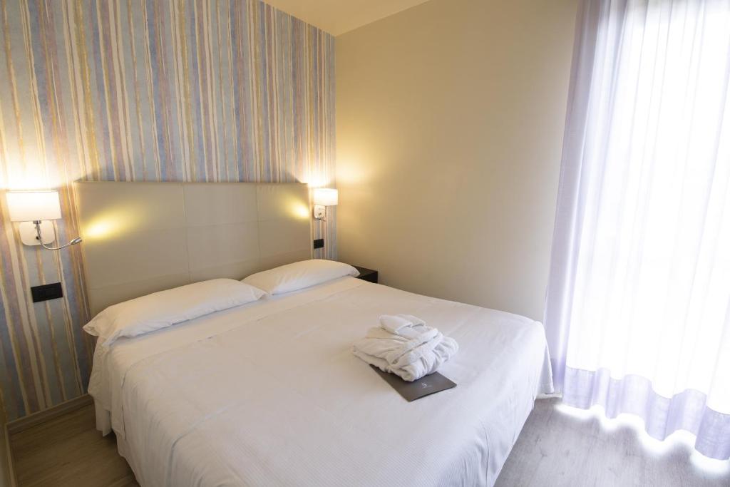 Postel nebo postele na pokoji v ubytování Hotel Parigi 2 & Spa
