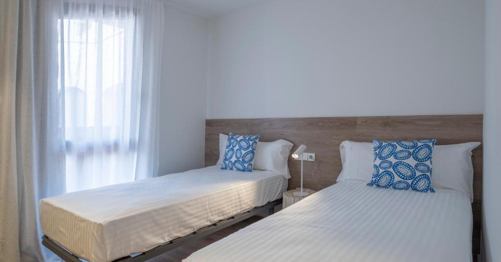 Postel nebo postele na pokoji v ubytování Cliper Apartments by Escampa Hotels