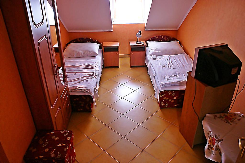 Posteľ alebo postele v izbe v ubytovaní Abigél Vendégház