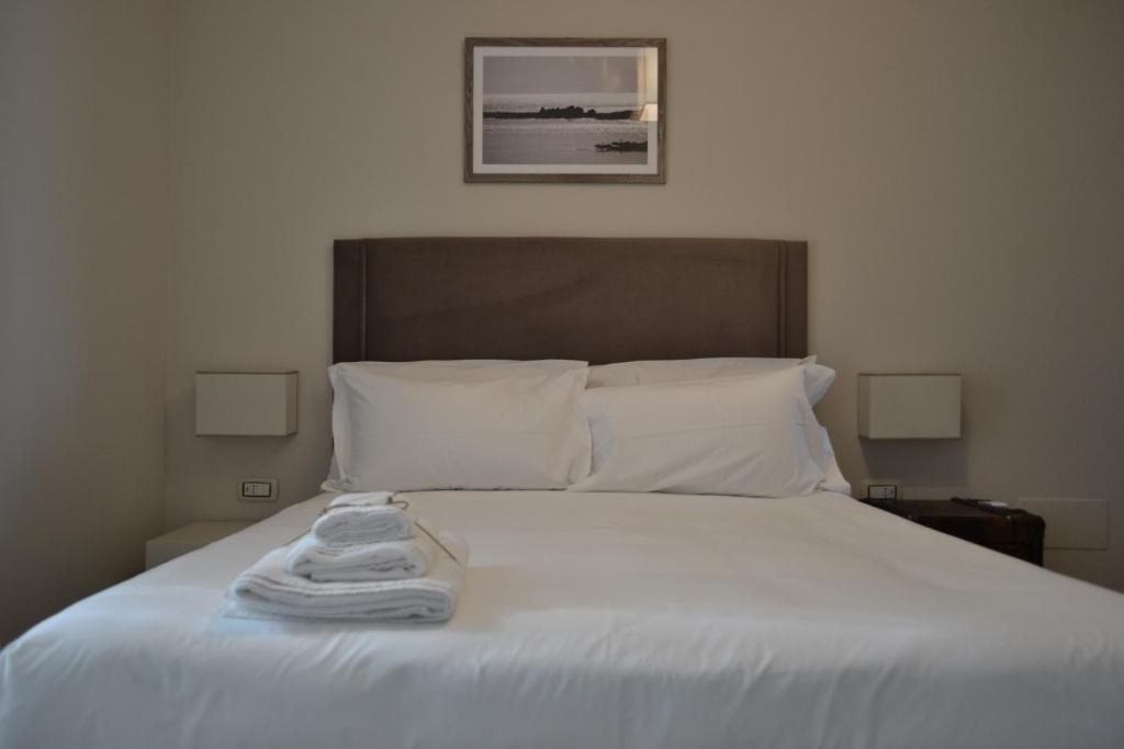 A bed or beds in a room at Gatto Bianco Le Terrazze