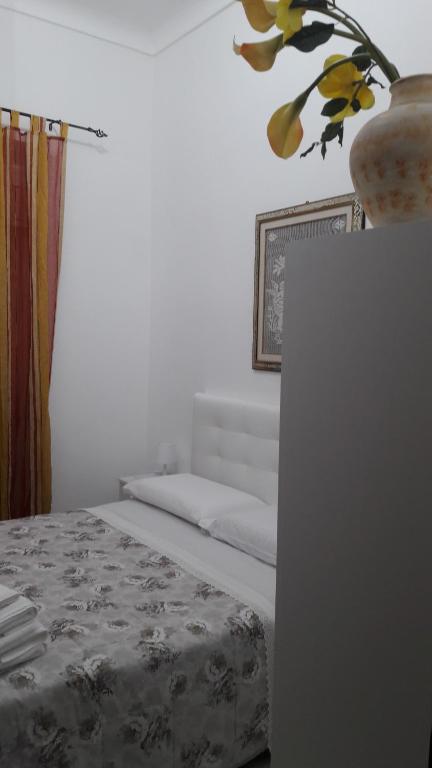 Postel nebo postele na pokoji v ubytování Vendicari