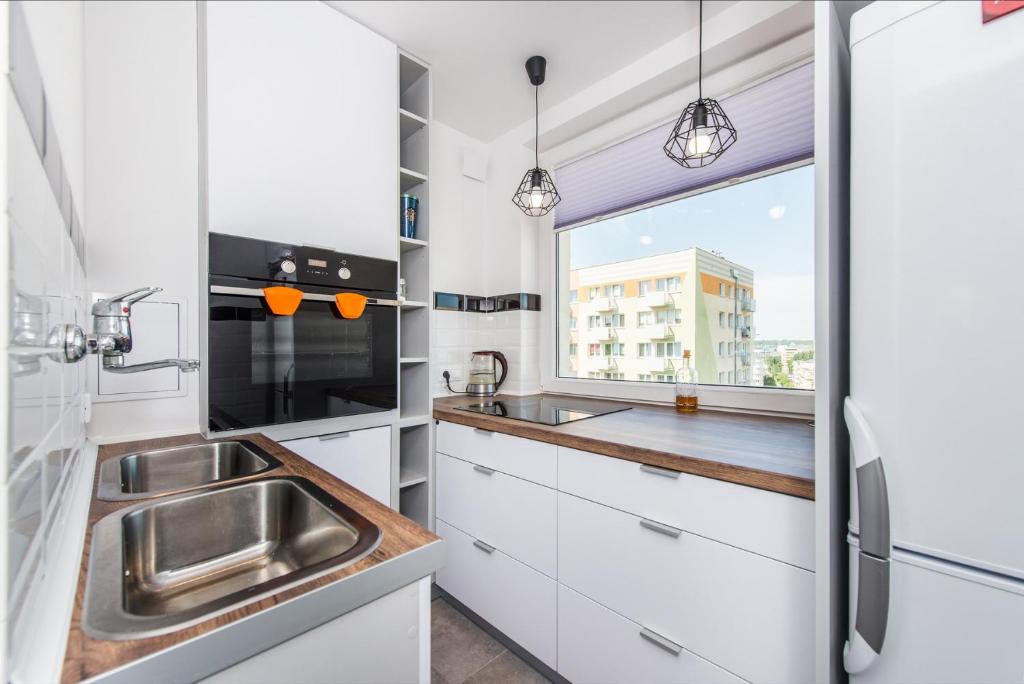 Kuchyň nebo kuchyňský kout v ubytování Avis Apartments - City Gdynia 38
