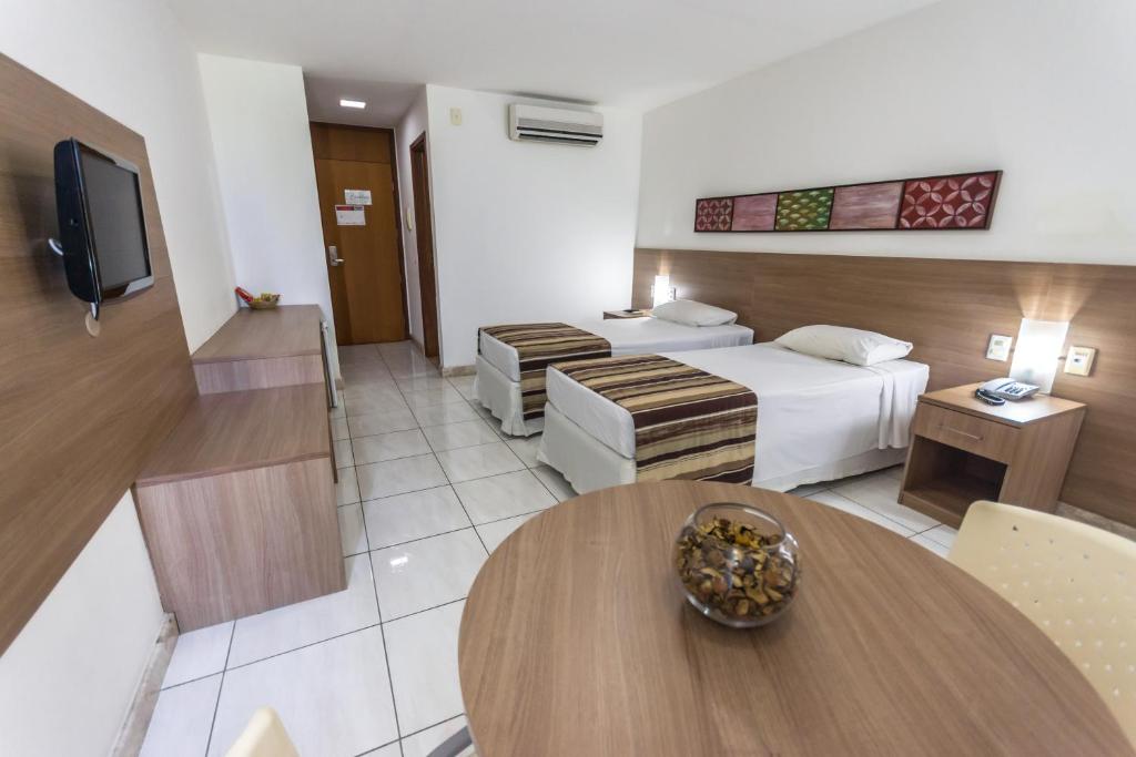 TV a/nebo společenská místnost v ubytování Cambuci Hotel
