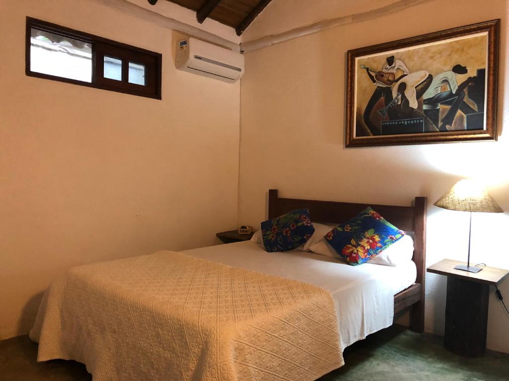 Postel nebo postele na pokoji v ubytování Pousada Estalagem Paraty