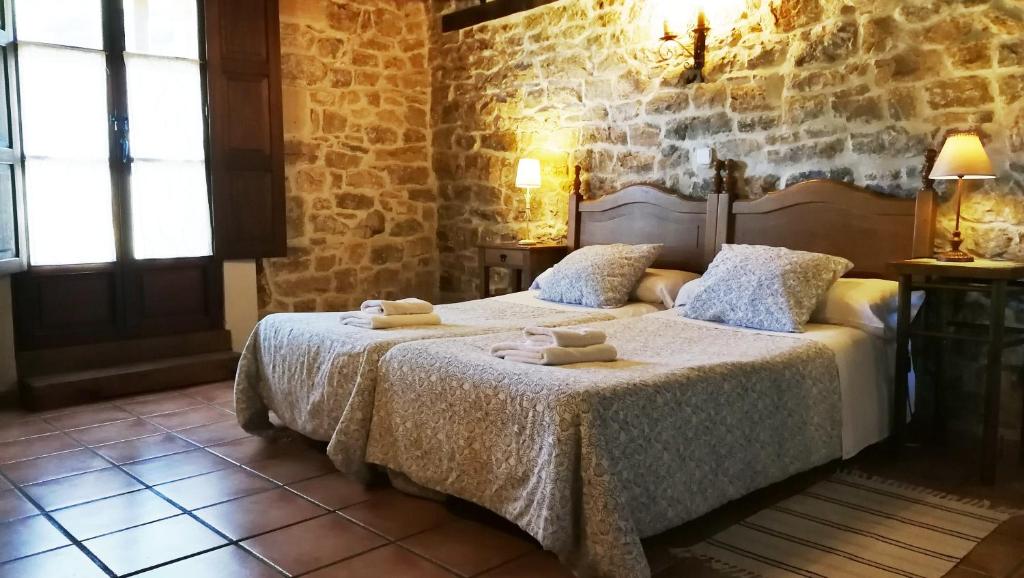 Postel nebo postele na pokoji v ubytování Casa rural La Toba I y II