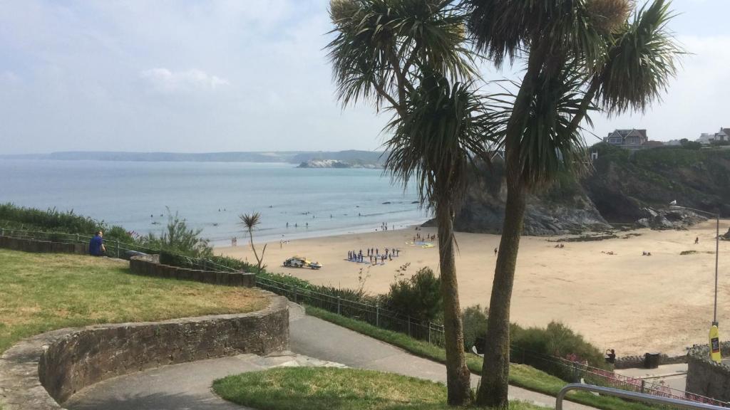 a view of a beach with people in the water at Palace Surf Lodge in Newquay