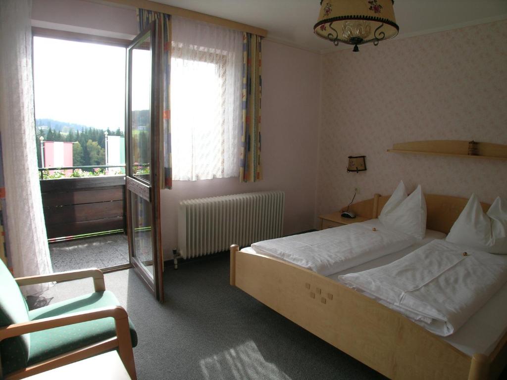 Postel nebo postele na pokoji v ubytování Hotel Tischlbergerhof