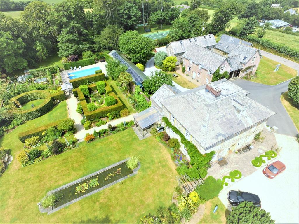 an aerial view of a large house with a garden at Glebe House Cottages in Bude