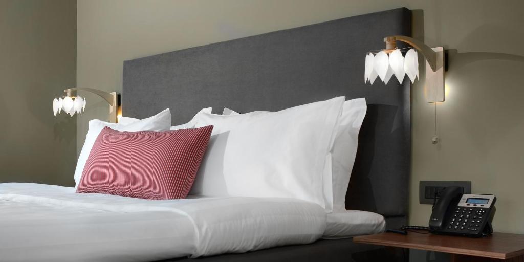 A bed or beds in a room at Lake Spirit Boutique Hotel & Spa