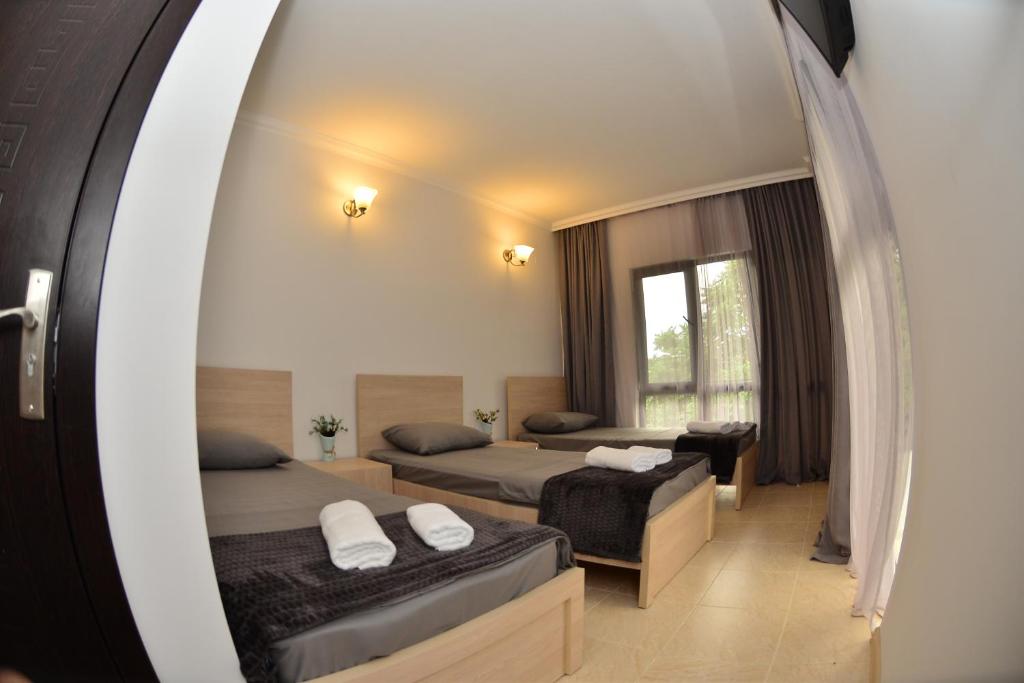 Postel nebo postele na pokoji v ubytování Hotel Gori